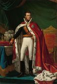 Koning Willem I (1814-1840). De koning wijst met zijn vinger naar de kaart van Nederlands-Indië waar in zijn visie de toekomst van het koninkrijk ligt.