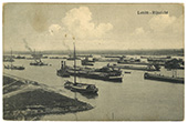 Rijnvaart, 1890-1940. Prentbriefkaart van een groot aantal binnenschepen, rijnaken, sleepboten en zeilende binnenschepen, gemeerd en voor anker liggend op de Rijn bij Lobith [gedateerd tussen 1890 en 1940].